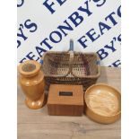 A WICKER BASKET CONTAINING WOODEN MONEY BOX AND 2 ASH WOOD ITEMS INC CENTRE BOWL