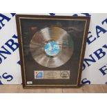 OFFICIAL AMERICAN RIAA AWARD FOR THE ALBUM REACH THE BEACH BY THE FIXX WHICH IS THERE MOST