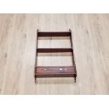 A REPRODUCTION MAHOGANY WALL HANGING SHELF WITH DRAWER