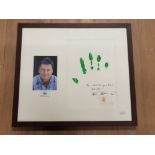 A FRAMED SIGNATURE AND HAND PRINT BY ALAN TITCHMASH ACCOMPANIED WITH A PHOTOGRAPH OF THE MAN