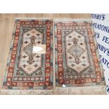 PAIR OF GENUINE HANDMADE FRINGED TURKISH WOOL RUGS IN A TRADITIONAL STYLE , 77CM X 124CM WITH