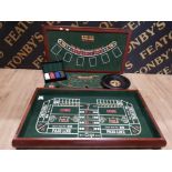 A 4 IN 1 COMPLETE SET THAT INCLUDES ROULETTE CRAPS FOUR FIVE SIX DICE GAME