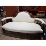 A 19TH CENTURY FRENCH WALNUT SALON SETTEE UPHOLSTERED IN CREAM FABRIC