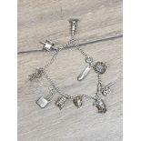 STERLING SILVER BRACELET WITH CHARMS WHICH ARE MOSTLY ORIENTAL THEMED ALL 900 STANDARD SILVER