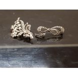 TWO SILVER AND MARCASITE BROOCHES ONE BOUQUET DESIGN THE OTHER BOW BOTH STAMPED 925