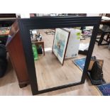 A MODERN WALL MIRROR IN BLACK STEPPED FRAME 106 X 86 CM