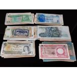 A COLLECTION OF WORLD BANKNOTES IN MIXED CIRCULATED GRADES 220 APPROX