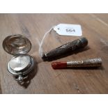 A SILVER SOVEREIGN CASE BIRMINGHAM DATE MARK A TOGETHER WITH A CIGARETTE HOLDER AND CASE