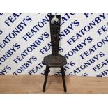 EARLY 20TH CENTURY EBONISED AND CARVED SPINNING CHAIR DATED 1903 WITH MONOGRAM EME