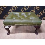 A 20TH CENTURY STAINED WOOD AND GREEN LEATHER BUTTONED FOOTSTOOL 41.5CM WIDE