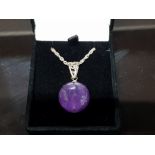 A LARGE AMETHYST BEAD AND SILVER PENDANT AND CHAIN STAMPED 925