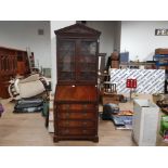 A NARROW REPRODUCTION MAHOGANY BOOKCASE BUREAU WITH GLAZED ASTRAGAL DOORS AND GREEN LEATHER