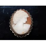 A SILVER MOUNTED CAMEO BROOCH DEPICTING A GRECIAN LADY
