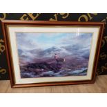 A COLOUR PRINT OF A STAG IN A HIGHLAND LANDSCAPE