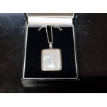 A SILVER AND MOTHER OF PEARL 9BLONG PENDANT AND CHAIN HALLMARKED