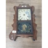 LATE VICTORIAN OAK FRAMED WALL CLOCK WITH MOTHER AND DAUGHTER INLAID TO THE DOOR HAS PENDULUM SAS