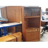 A TEAK CORNER UNIT BY G-PLAN GLAZED SLIDING DOORS ABOVE GLASS SHELF WITH CUPBOARD BELOW 105 X 170