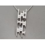 9CT WHITE GOLD DIAMOND PENDANT WITH CURBCHAIN, APPROXIMATELY 1CT G COLOUR IVS, 8.3G