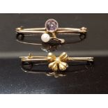 TWO ANTIQUE YELLOW METAL BROOCHES ONE WITH PURPLE STONE AND PEARL THE OTHER FOUR LEAF CLOVER 2.4G