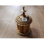 A MIDDLE EASTERN HEAVY AND ORNATE BRASS POT AND COVER RAISED ON 5 FEET