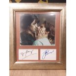 TOM CRUISE AND PENEOPLE CRUZ AUTOGRAPHS WITH A PHOTO OF THE STARS IN A SCENE FROM THE 2001 SCI/FI