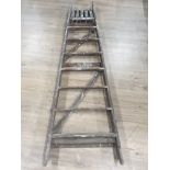 A SET OF WOODEN 8 STEP LADDERS