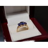 18CT YELLOW GOLD AND TANZANITE SET RING, CLARITY VS, COLOUR AAA MINIMUM, OVAL SHAPED CUT WITH