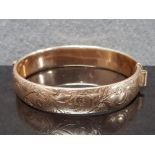 9CT GOLD ON SILVER BANGLE MARKED 1/5 9CT, AG AND MAKER R AND W PROBABLY RIGBY AND WILSON FERN ETCHED