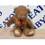 JOINTED MOHAIR GROWLING TEDDY WITH BOW AROUND NECK