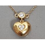 18CT YELLOW GOLD DIAMOND HEART PENDANT SET WITH SIX DIAMONDS ON THE CHAIN, 4.5G