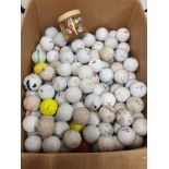 A LARGE BOX OF GOLF BALLS AND GOLF TEES