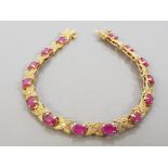 GOLD PLATED 14 STONE RUBY LINE BRACELET