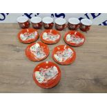 A CHINESE TEA SET FOR 6 DECORATED WITH FIGURES ON ORANGE GROUND COMPRISING TEAPOT CUPS AND SAUCERS