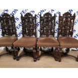A SET OF 6 HEAVILY CARVED VICTORIAN/EDWARDIAN DINING CHAIRS WITH X FRAME STRETCHERS