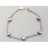 SILVER AND 5 STONE TOPAZ LINE BRACELET