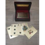 A LUXURIOUS SET OF 24CT GOLD PLAYING CARDS IN NICELY PRESENTED DISPLAY BOX