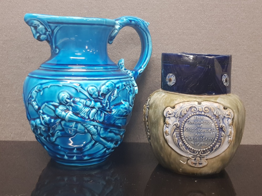 A MAJOLICA BLUE GLAZE JUG BY SARREGUEMINES DEPICTING DON QUIXOTE AND SANCHO PANZA STAMPED 43 212 K