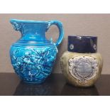 A MAJOLICA BLUE GLAZE JUG BY SARREGUEMINES DEPICTING DON QUIXOTE AND SANCHO PANZA STAMPED 43 212 K