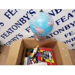 A BOX CONTAINING TOYS BOOKS GAMES WORLD GLOBE ETC