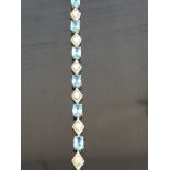 9CT GOLD AND BLUE TOPAZ BRACELET 5.2GRAMS