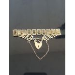 9CT GOLD GATE BRACELET WITH HEART CLASP AND SAFETY CHAIN 12.5GRAMS