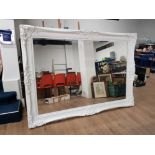 A VERY LARGE BEVELLED WALL MIRROR IN WHITE SCROLLING FRAME 155 X 212CM