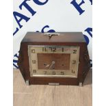 LATE 19TH CENTURY CARVED OAK MANTLE CLOCK WITH KEY AND PENDULUM
