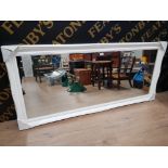 A LARGE WALL MIRROR WITH WHITE SWEPTED FRAME 76 X 167CM