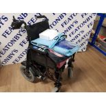 A BRAND NEW MOBILITY DIRECT ELECTRIC WHEEL CHAIR AND CHARGER WITH WATERPROOF GEAR