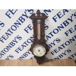 LATE 19TH CENTURY EARLY 20TH CENTURY ANEROID BAROMETER IN CARVED OAK 87CM