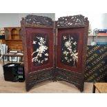 AN EARLY 20TH CENTURY JAPANESE CARVED WOODEN FOLDING SCREEN WITH BONE INLAY DEPICTING BIRDS AMONGST