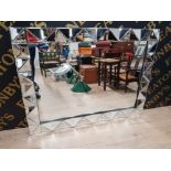 A LARGE MIRROR WITH BEVELLED GEOMETRIC FRAME 90.5 X 120.5CM