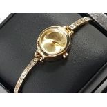 LADIES GOLD PLATED INFINITE WTISTWATCH, AS NEW WITH TAGS AND ORIGINAL BOX