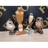 A CARVED WOODEN KESTREL TOGETHER WITH RESIN SCULPTURES OF A SPARROW HAWK AND OWLS